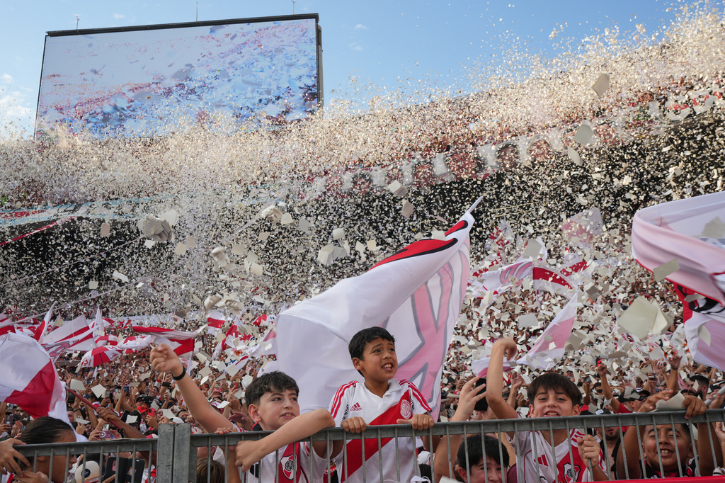 River Plate fans cheer during an Argentine league match against Boca Juniors in Buenos Aires, Argentina, Sunday, April 19, 2026. (AP Photo/Rodrigo Abd)