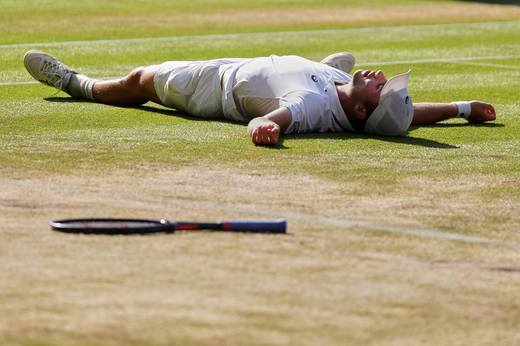 Arthur Fery of Britain reacts to winning against Flavio Cobolli of Italy in their quarter-final men's singles match at the Wimbledon Tennis Championships in London, Wednesday, July 8, 2026. (AP Photo/Maja Smiejkowska)