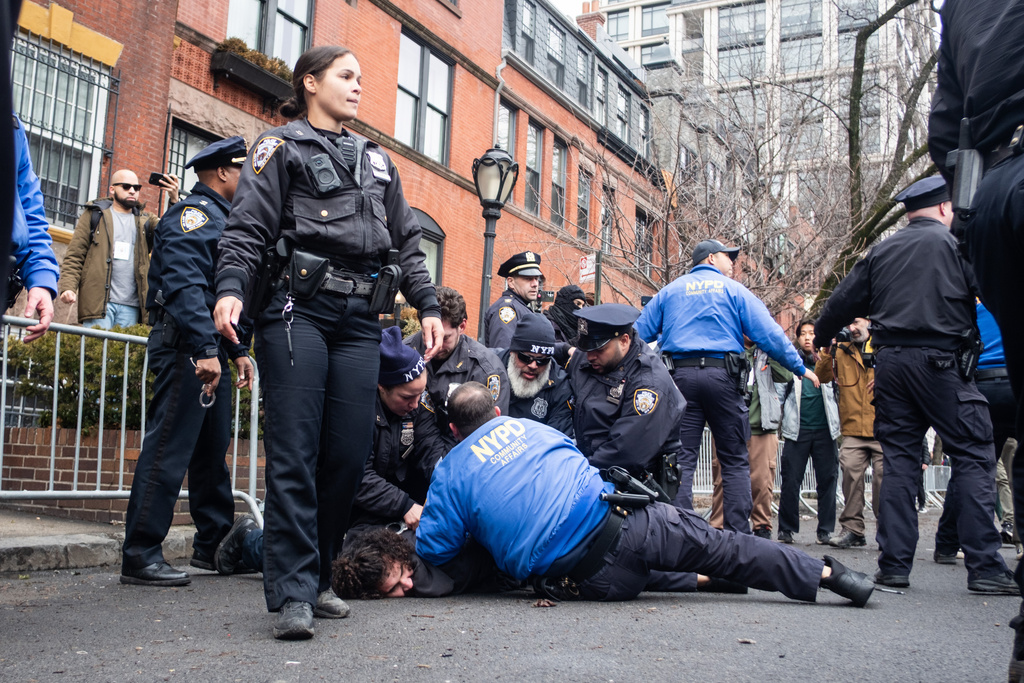 Police detain Emir Balat after he attempted to detonate an improvised explosive device during a counterprotest against far right influencer Jake Lang staging an anti-Islam protest outside Gracie Mansion, Saturday, March 7, 2026, in New York. (AP Photo/Julius Constantine Motal)