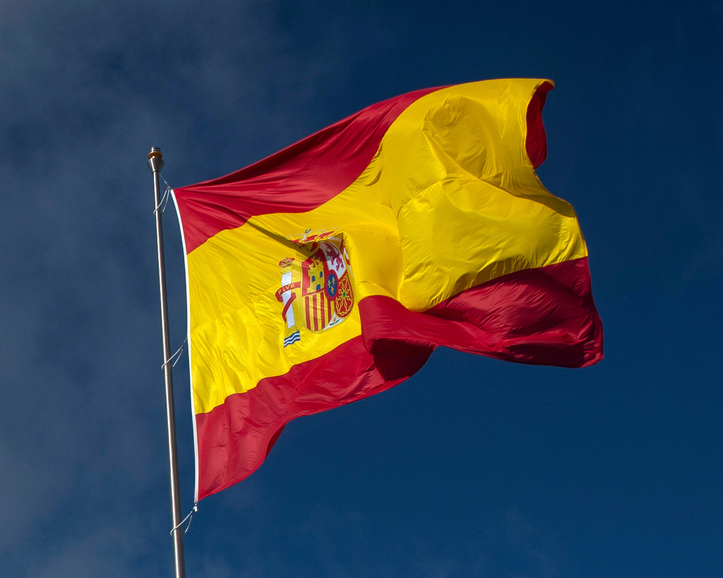 FILE - The Spanish flag flies during a memorial for coronavirus (COVID-19) victims in Madrid, Spain, Friday, Oct. 23, 2020. (AP Photo/Manu Fernandez, file)
