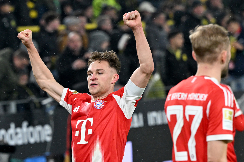 Bayern Munich's Joshua Kimmich celebrates scoring during the Bundesliga soccer match between Borussia Dortmund and FC Bayern Munich in Dortmund, Germany, Saturday Feb. 28, 2026. (Federico Gambarini/dpa via AP)