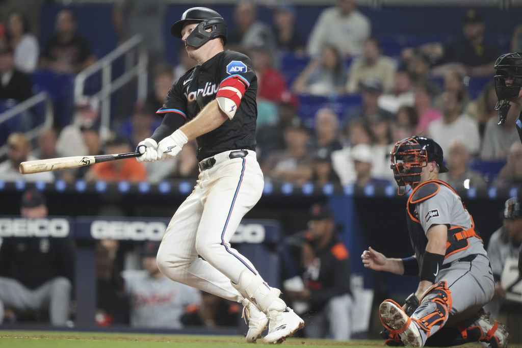 Miami Marlins' Eric Wagaman, left, watches after hitting a single during the sixth inning of a baseball game against the Detroit Tigers, Friday, Sept. 12, 2025, in Miami. (AP Photo/Lynne Sladky)