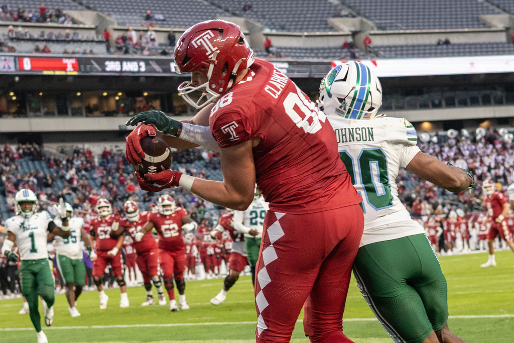 Temple tight end Peter Clarke (88) catches a touchdown pass in the end zone near Tulane defensive back Jahiem Johnson, right, during the first half of an NCAA college football game, Saturday, Nov. 22, 2025, in Philadelphia. (AP Photo/Laurence Kesterson)