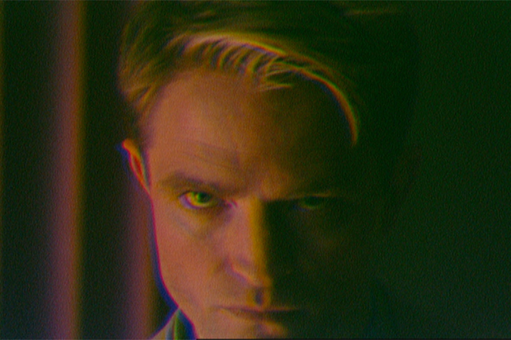 This image released by A24 shows Robert Pattinson, left, in a scene from the film "Primetime." (A24 via AP)