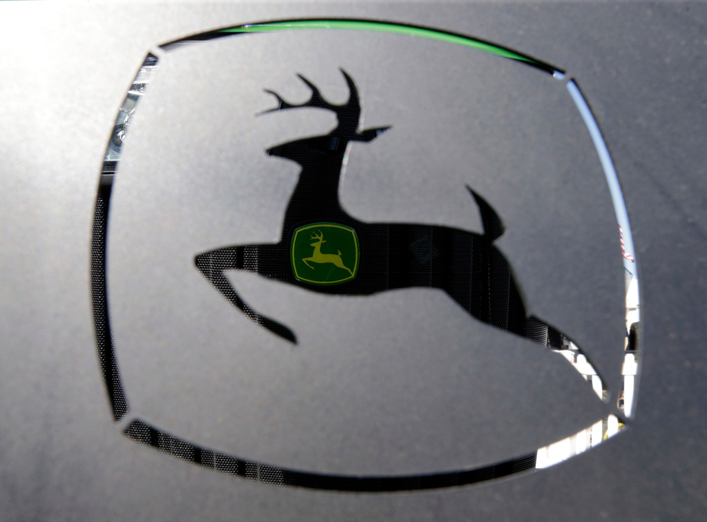 FILE - A John Deer emblem is seen at the Husker Harvest Days farm show in Wood River, Neb., Sept. 12, 2018. (AP Photo/Nati Harnik, File)