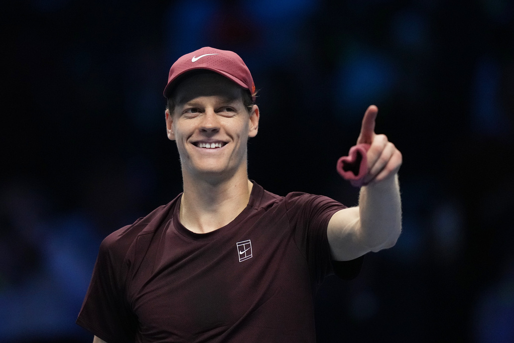 Italy's Jannik Sinner celebrates after winning against Canada's Felix Auger-Aliassime during their tennis match of the ATP World Tour Finals, in Turin, Italy, Monday, Nov. 10, 2025. (AP Photo/Antonio Calanni)