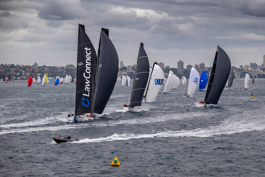 In this photo provided by the Cruising Yacht Club of Australia, competitors make a start in the Sydney Hobart yacht race in Sydney, Friday, Dec. 26, 2025. (Kurt Arrigo/CYCA via AP)
