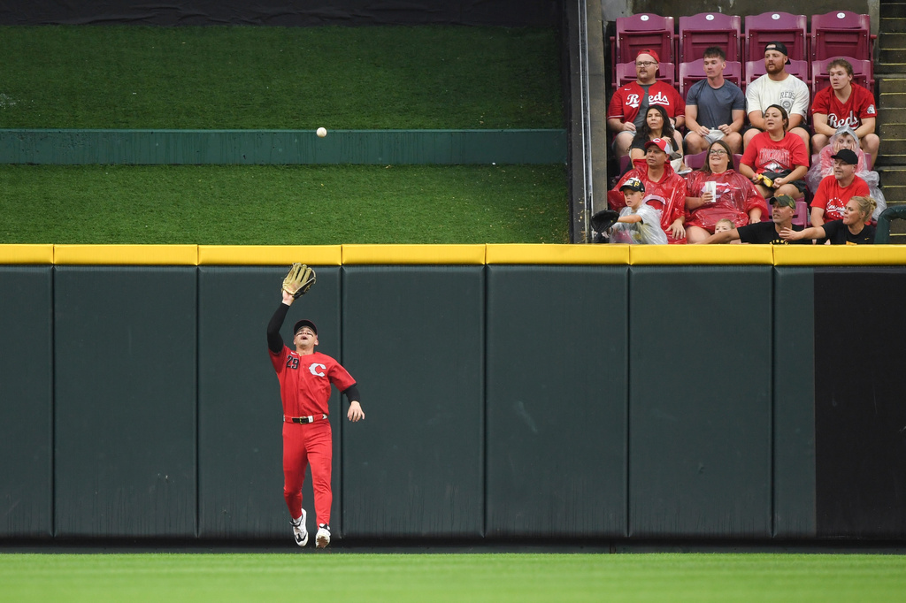 Cincinnati Reds center fielder TJ Friedl fields a fly ball by Pittsburgh Pirates' Bryan Reynolds during the first inning of a baseball game in Cincinnati, Saturday, Aug. 1, 2026. (AP Photo/Tanner Pearson)