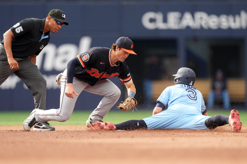 Toronto Blue Jays' Myles Straw (3) is caught stealing at Detroit Tigers shortstop John Peck (18) applied the tag during the fourth inning of a baseball game in Toronto, Wednesday, Sept. 16, 2026. (Nathan Denette/The Canadian Press via AP)