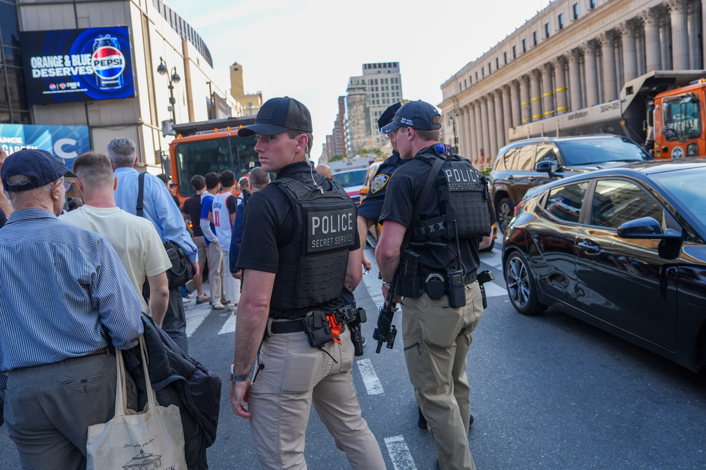 Secret Service agents stand guard in front of Madison Square Garden ahead of Game 3 of the NBA Finals, Monday, June 8, 2026, in New York. (AP Photo/Ryan Murphy)