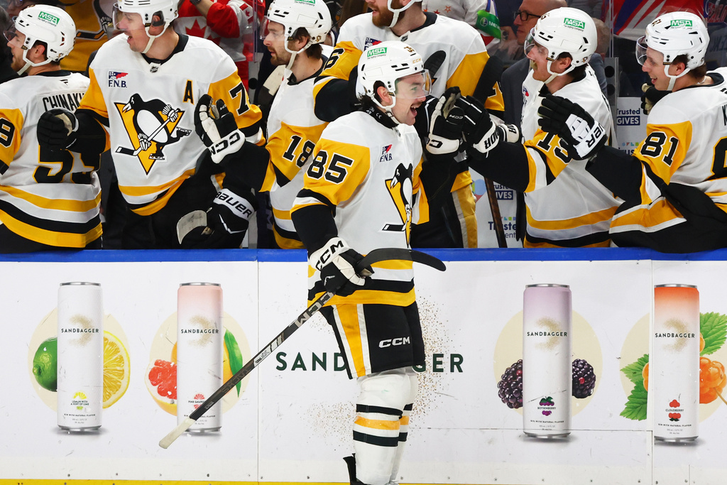 Pittsburgh Penguins forward Avery Hayes (85) celebrates his goal during the first period of an NHL hockey game against the Buffalo Sabres Thursday, Feb. 5, 2026, in Buffalo, N.Y. (AP Photo/Jeffrey T. Barnes)