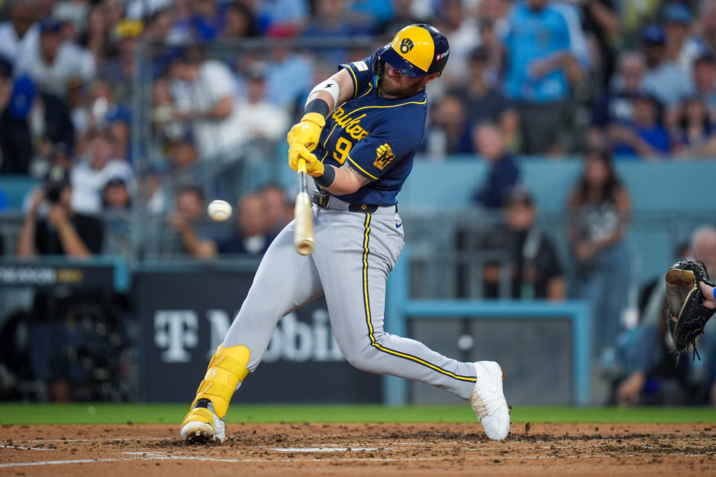 Milwaukee Brewers first baseman Jake Bauers connects for a two-RBI double during the fourth inning of Game 4 of baseball's National League Championship Series between the Milwaukee Brewers and the Los Angeles Dodgers, Thursday, Oct. 15, 2026, in Los Angeles. (AP Photo/Gregory Bull)
