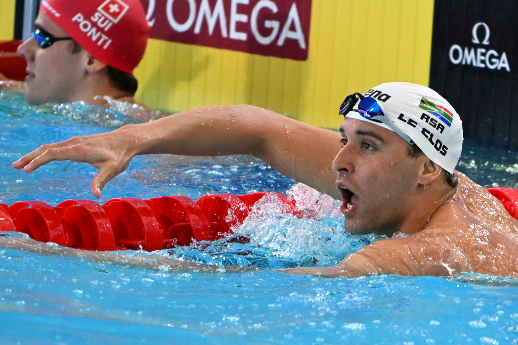FILE -Chad le Clos of South Africa celebrates after winning the men's 100m butterfly final during the world swimming short course championships in Melbourne, Australia, Dec. 18, 2022. (AP Photo/Asanka Brendon Ratnayake), File)