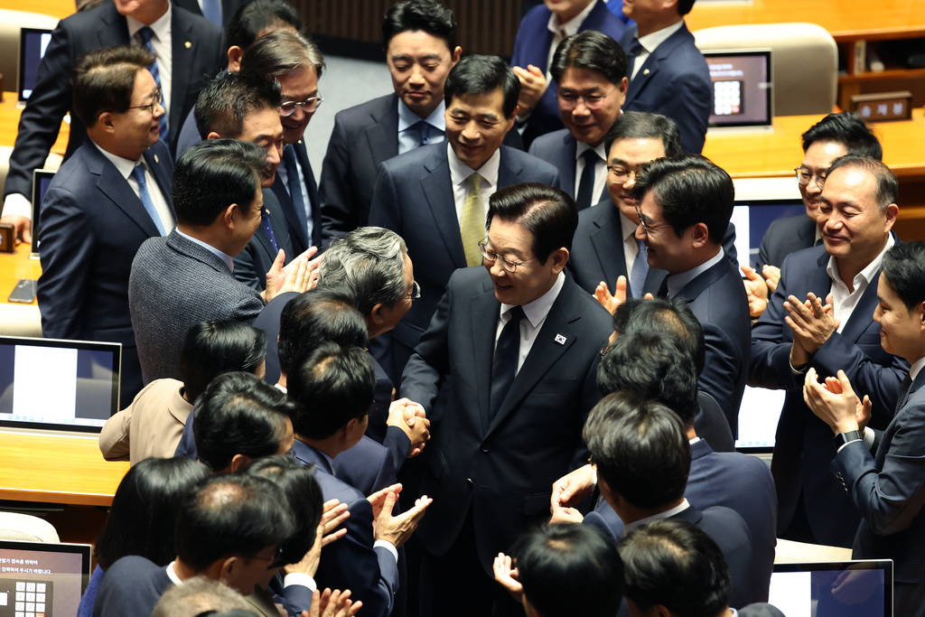 South Korean President Lee Jae Myung leaves after speaking at the National Assembly in Seoul, South Korea, Tuesday, Nov. 4, 2025. (Chung Sung-Jun/Pool Photo via AP)
