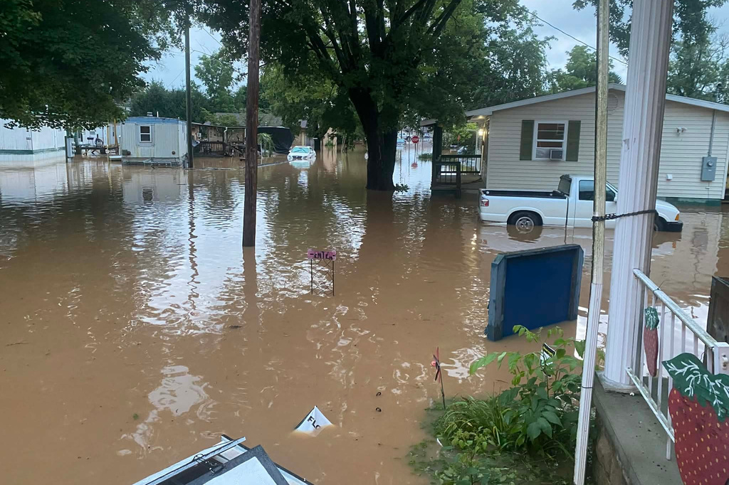 This photo provided by Joe Kinzer shows flash flooding Tuesday, July 21, 2026, in Buckhannon, W.Va. (Joe Kinzer via AP)
