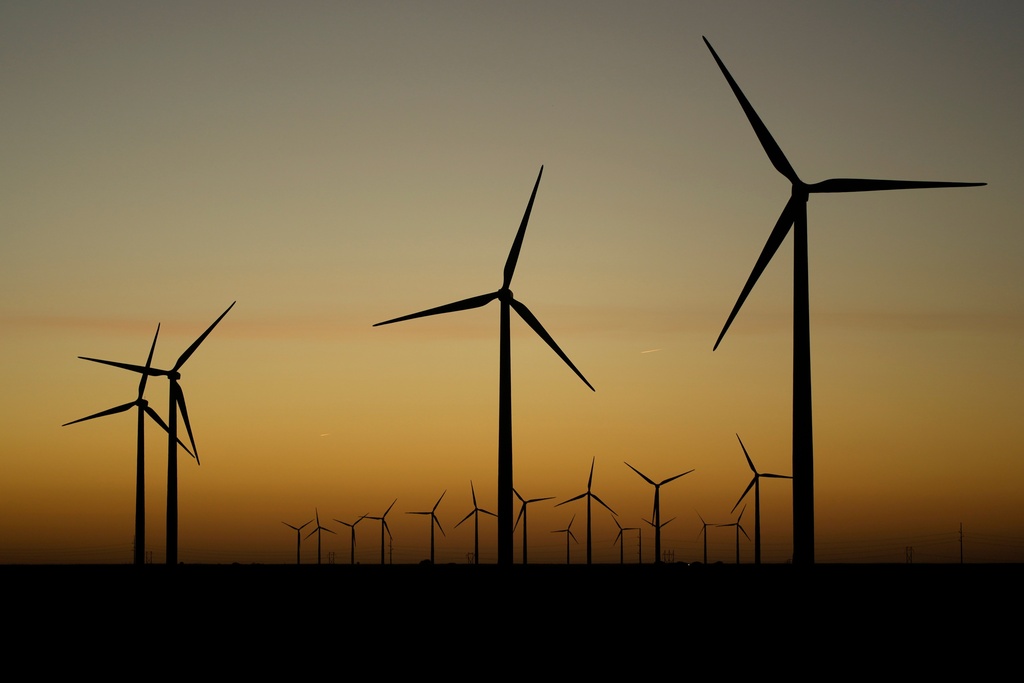 FILE - Wind turbines stretch across the horizon at dusk at the Spearville Wind Farm, Sept. 29, 2024, near Spearville, Kan. (AP Photo/Charlie Riedel, File)