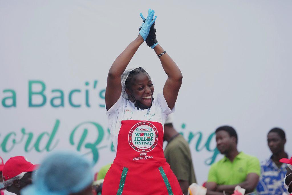 Chef Hilda Baci attempts to cook the world's largest pot of Jollof Rice in Lagos, Nigeria, on Friday, Sept 12, 2025. (AP Photo/Sunday Alamba)
