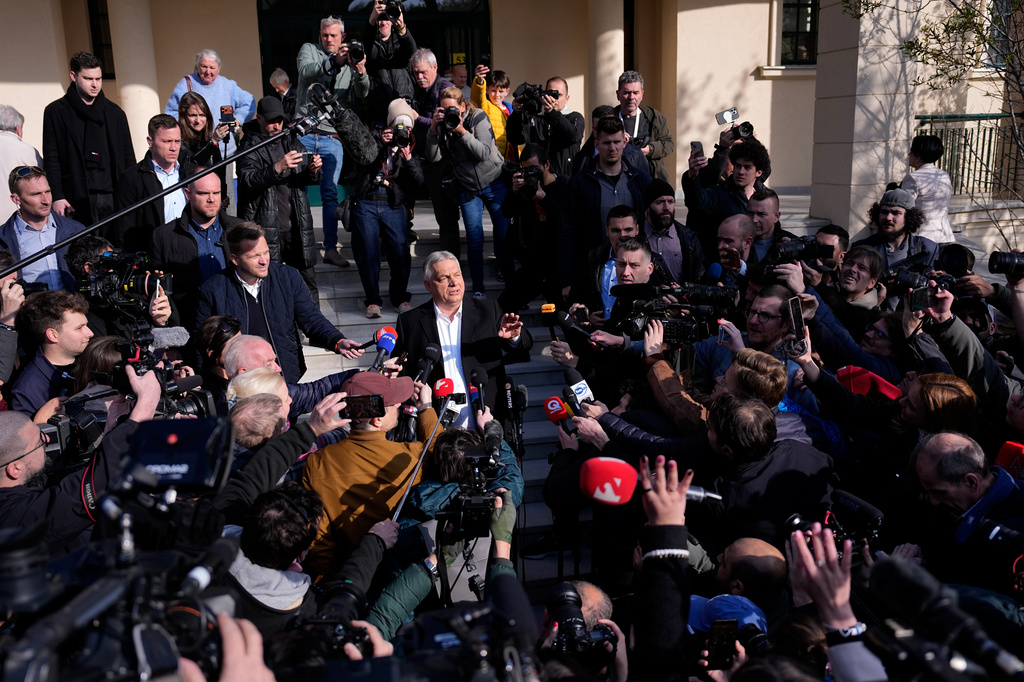 Hungary's Prime Minister Viktor Orban addresses the media outside a polling station after voting in Budapest, Hungary, Sunday, April 12, 2026. (AP Photo/Petr David Josek)