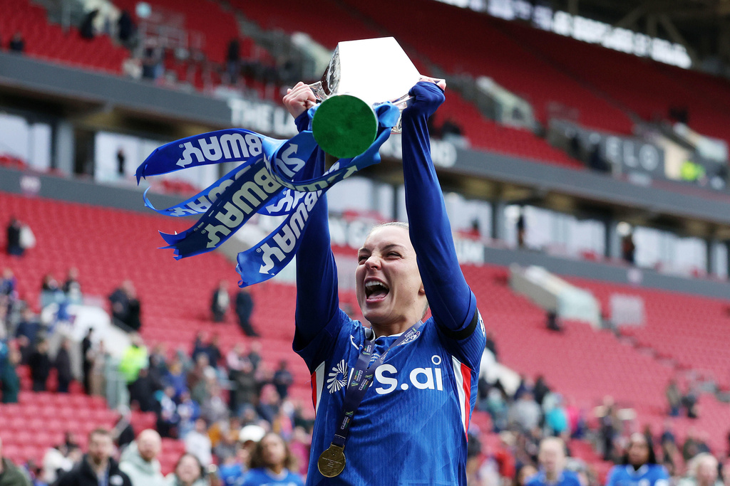 Chelsea's Johanna Rytting Kaneryd celebrates with the trophy after winning the Women's League Cup final, in Bristol, England, Sunday, March 15, 2026. (Steve Paston/PA via AP)