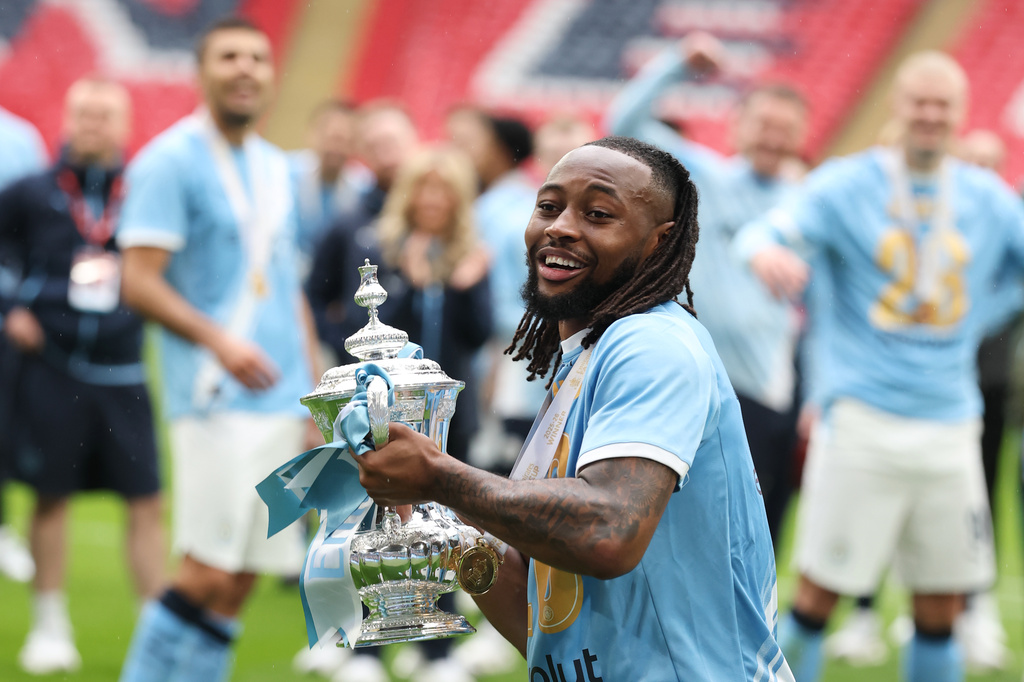 Manchester City's Antoine Semenyo holds the winner's trophy after the English FA Cup final soccer match between Chelsea and Manchester City in London, Saturday, May 16, 2026. (AP Photo/Richard Pelham)