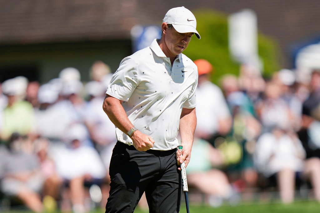 Rory McIlroy, of Northern Ireland, reacts after his shot on the 18th green during the third round of the PGA Championship golf tournament at Aronimink Golf Club, Saturday, May 16, 2026, in Newtown Square, PA. (AP Photo/Frank Franklin II)