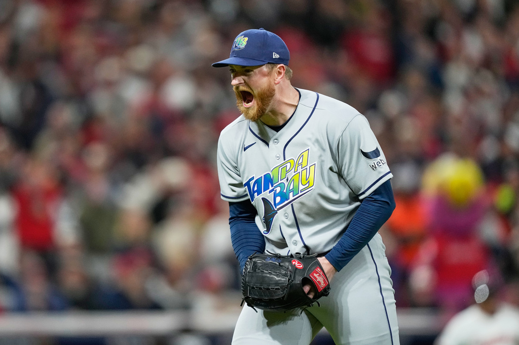 Tampa Bay Rays pitcher Drew Rasmussen celebrates the end of the seventh inning against the Cleveland Guardians in Game 5 of an American League Championship Series baseball game in Cleveland, Sunday, Oct. 18, 2026. (AP Photo/David J. Phillip)