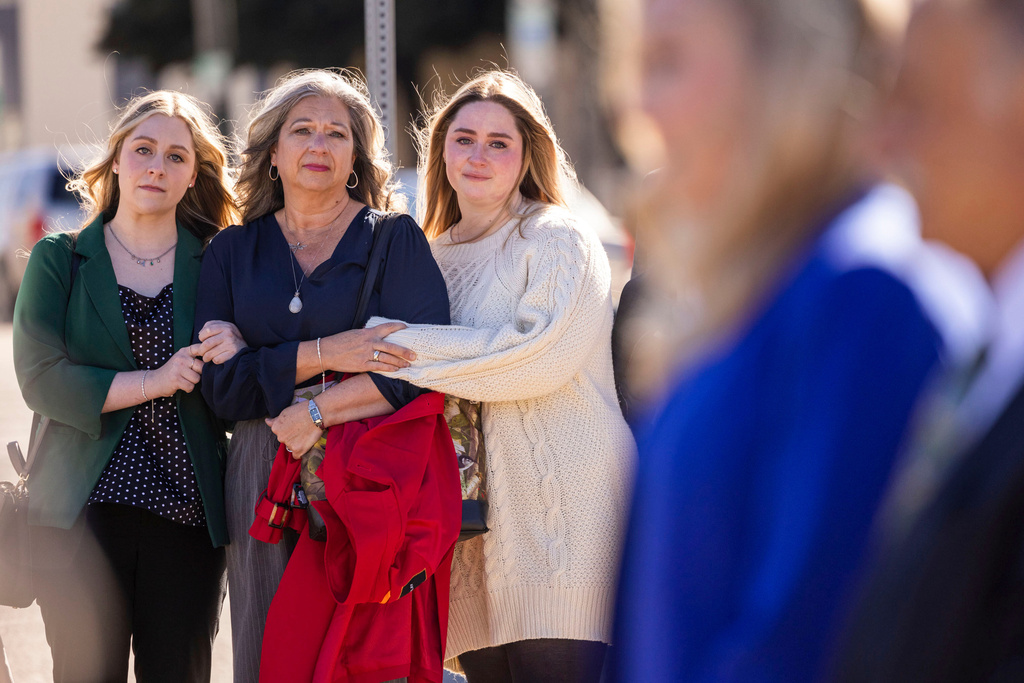 Abigail "Abby" Zwerner stands with her mother Julie and sister Hannah as her lawyers speak to members of the press after a verdict was reached in her lawsuit against the assistant principal, Ebony Parker, of Richneck Elementary School during proceedings at Newport News Circuit Court in Newport News, Va. on Thursday, Nov. 6, 2025. (Kendall Warner/The Virginian-Pilot via AP)