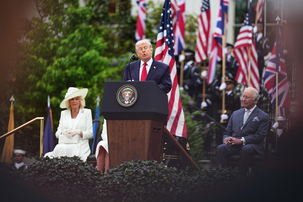 President Donald Trump speaks while Britain's Queen Camilla, left, and King Charles III, right, listen during an arrival ceremony on the South Lawn of the White House, Tuesday, April 28, 2026, in Washington. (AP Photo/Julia Demaree Nikhinson)