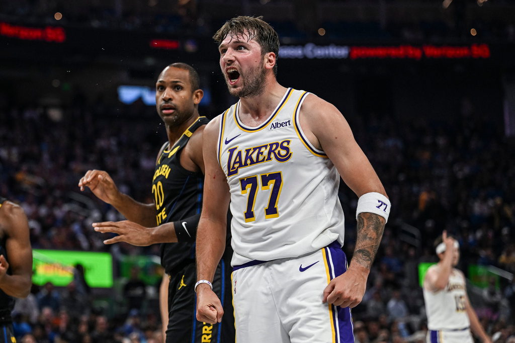 Los Angeles Lakers guard Luka Doncic (77) reacts during the first half of an NBA Cup basketball game against the Golden State Warriors, Saturday, Oct. 30, 2026, in San Francisco. (AP Photo/Justine Willard)
