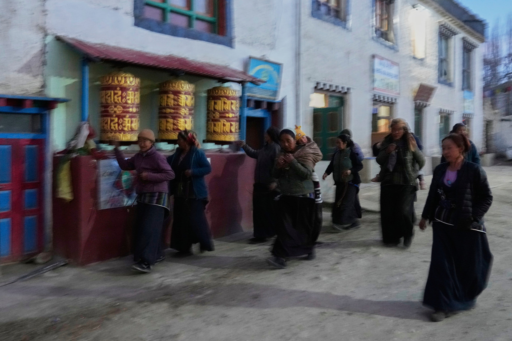 Nepalese Buddhist women walk back to their homes after an evening walk through monasteries in Lo Manthang village, Mustang, Nepal, April 18, 2025. (AP Photo/Niranjan Shrestha)