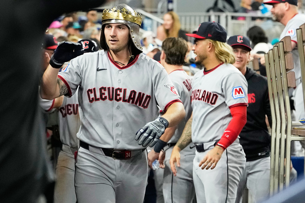 Cleveland Guardians' Chase DeLauter celebrates in the dugout after hitting a two run home run during the fourth inning of a baseball game against the Miami Marlins, Friday, July 10, 2026, in Miami. (AP Photo/Lynne Sladky)