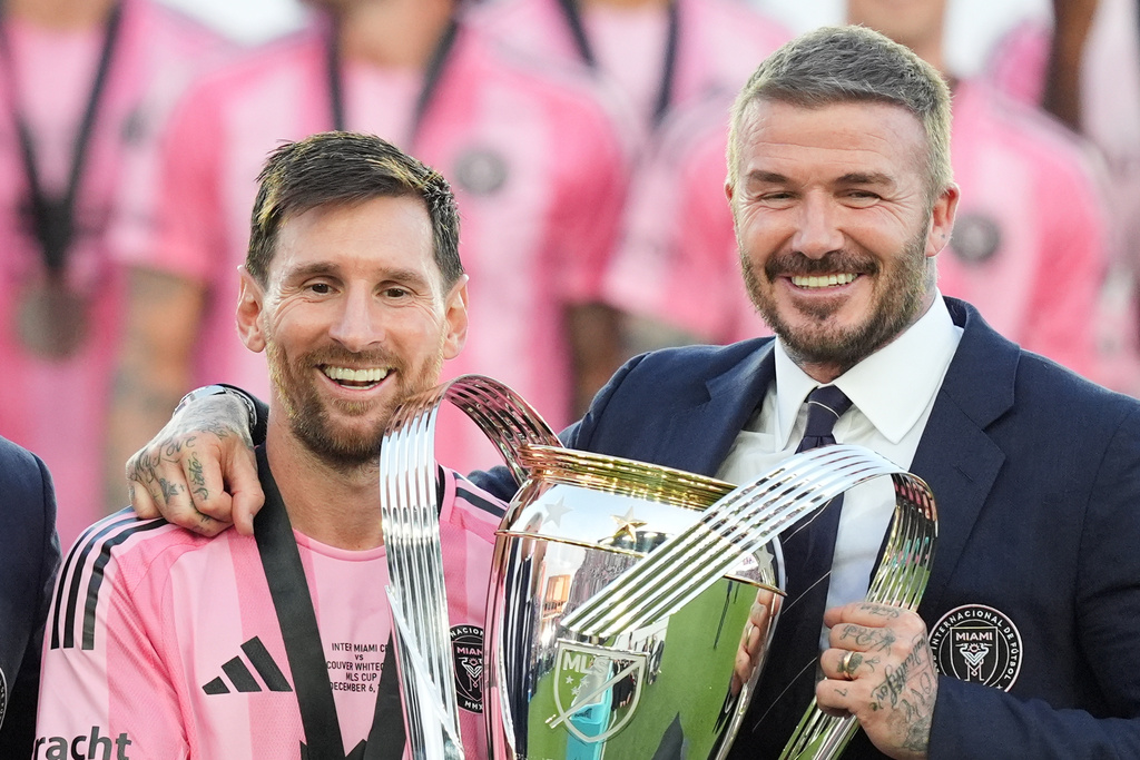 David Beckham poses with the MLS Cup trophy with Inter Miami forward Lionel Messi Saturday, Dec. 6, 2025, in Fort Lauderdale, Fla. (AP Photo/Rebecca Blackwell)