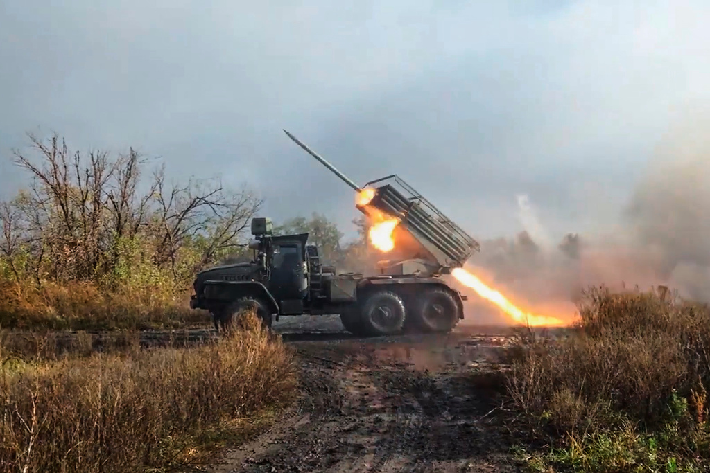 In this image made from video provided by Russian Defense Ministry Press Service on Friday, Nov. 7, 2025, a Russian "Grad" self-propelled 122 mm multiple rocket launcher fires towards Ukrainian positions on an undisclosed location in Ukraine. (Russian Defense Ministry Press Service via AP)