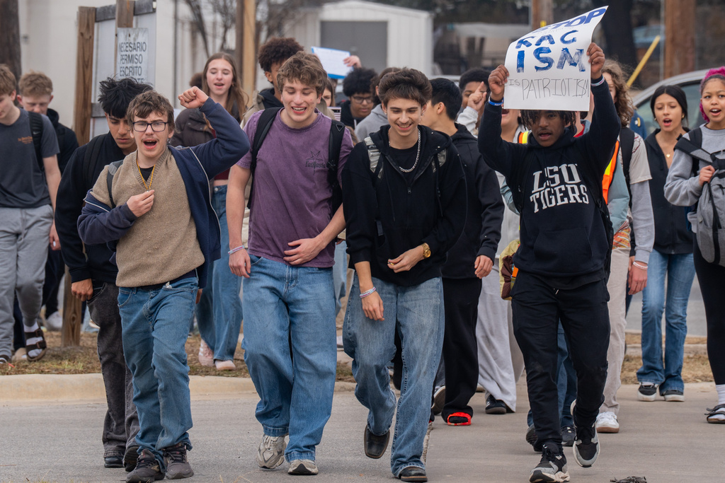 McCallum High School students walk out of class in protest of ICE in Austin, Texas, Friday, Jan. 30, 2026. (Mikala Compton/Austin American-Statesman via AP)