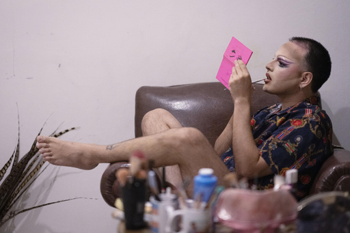 Nelson Viveros applies lipstick as he transforms into his drag persona, Dislexia, at his home in Asuncion, Paraguay, Friday, Sept. 12, 2025. (AP Photo/Jorge Saenz) Nelson Viveros applies lipstick as he transforms into his drag persona, Dislexia, at his home in Asuncion, Paraguay, Friday, Sept. 12, 2025. (AP Photo/Jorge Saenz)