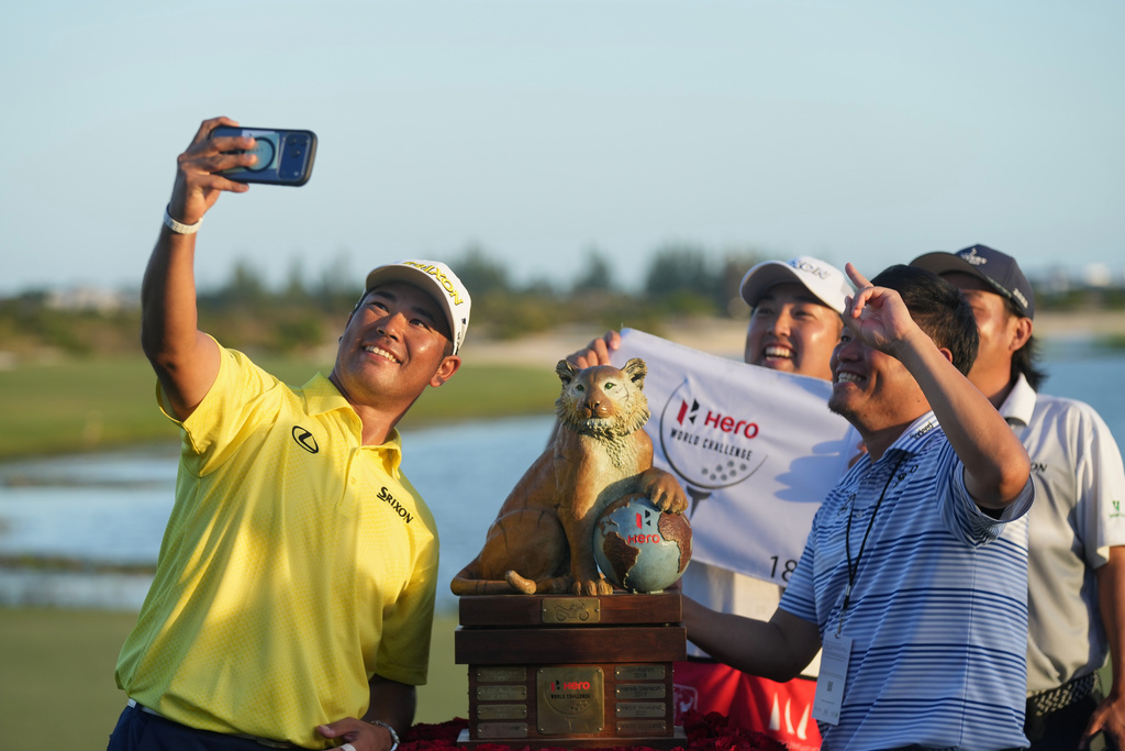 Hideki Matsuyama, of Japan, takes a selfie with staff after winning the Hero World Challenge PGA Tour at the Albany Golf Club, in New Providence, Bahamas, Sunday, Dec. 7, 2025. (AP Photo/Fernando Llano)