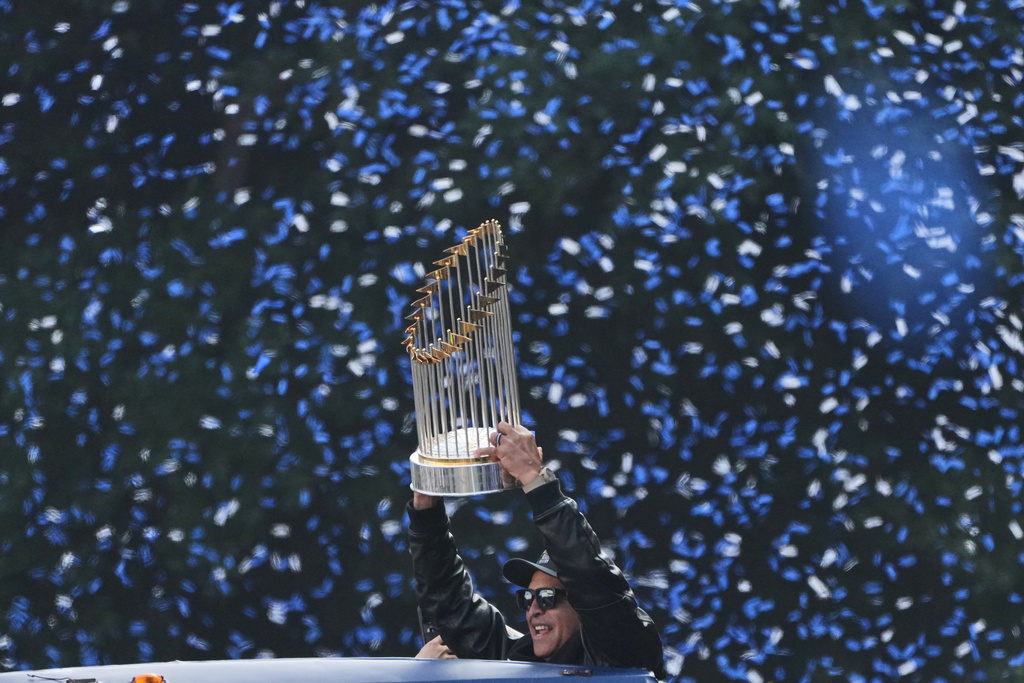 Los Angels Dodgers manager Dave Roberts holds the World Series trophy during a parade to celebrate the baseball team's World Series win on Monday, Nov. 3, 2025, in Los Angeles. (AP Photo/Jae C. Hong)