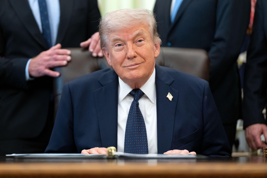 President Donald Trump listens during an event on health care affordability in the Oval Office at the White House, Thursday, April 23, 2026, in Washington. (AP Photo/Mark Schiefelbein)