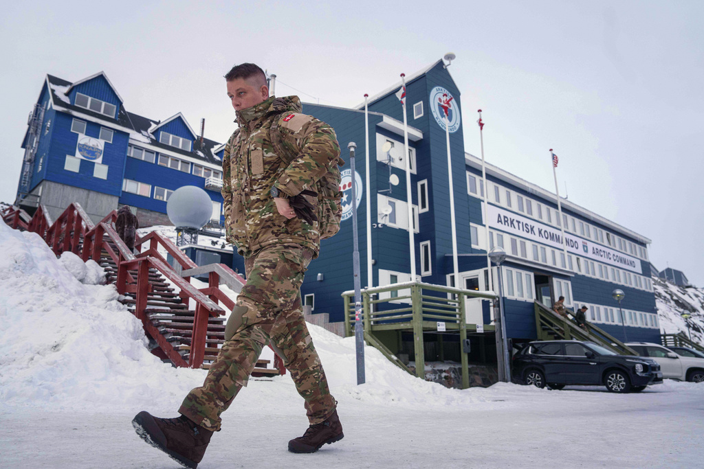 FILE - A Danish serviceman walks in front of Joint Arctic Command center in Nuuk, Greenland, Jan. 16, 2026. (AP Photo/Evgeniy Maloletka, File)