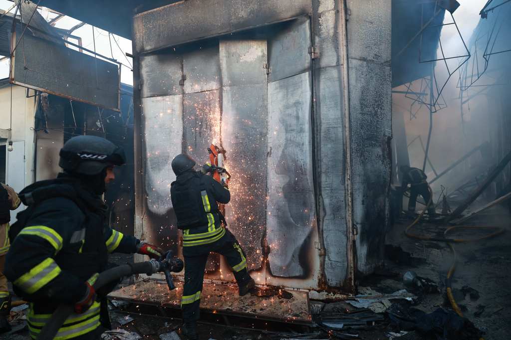 Rescuers work on a site of Russian drone strike on the central market of Zaporizhzhia, Ukraine, on Saturday, Sept. 26, 2026. (AP Photo/Kateryna Klochko)