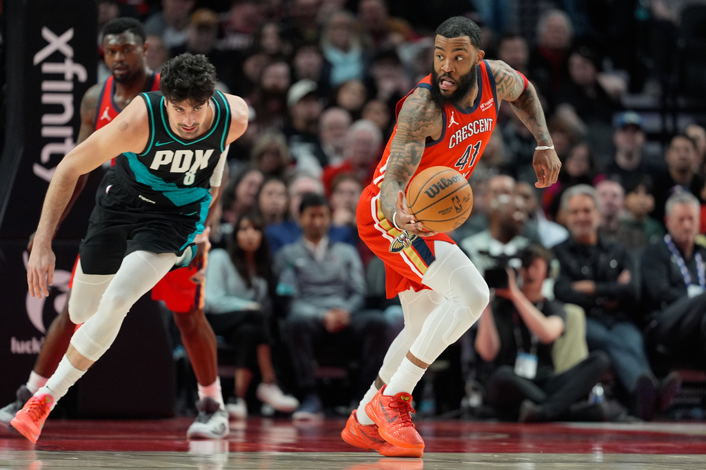 New Orleans Pelicans center Saddiq Bey (41) tries to get past Portland Trail Blazers forward Deni Avdija (8) during the first half of an NBA basketball game Thursday, April 2, 2026, in Portland, Ore. (AP Photo/Jenny Kane)