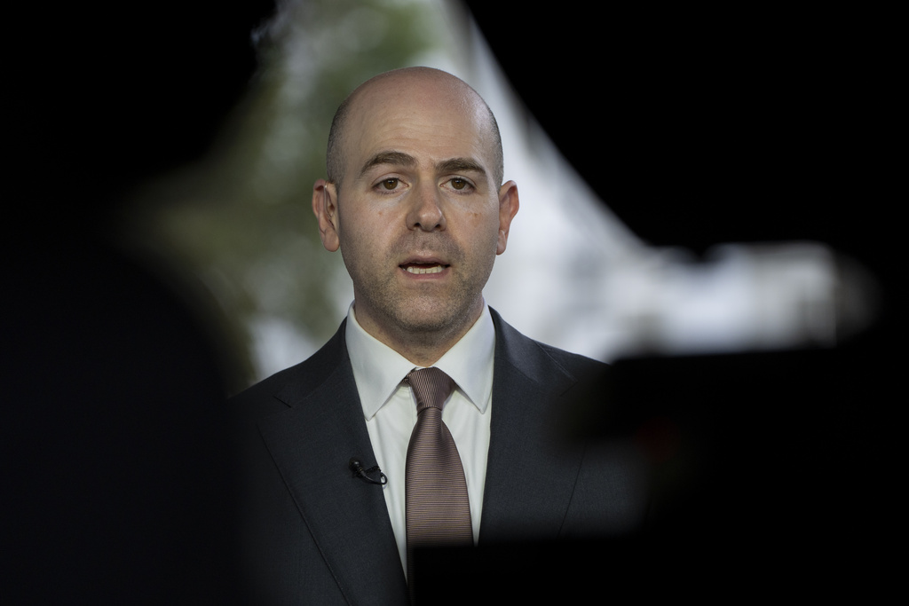 Stephen Miran, chairman of the Council of Economic Advisors and President Donald Trump's pick to serve on the Federal Reserve, speaks during a television interview at the White House, Tuesday, Aug. 12, 2025, in Washington. (AP Photo/Alex Brandon)