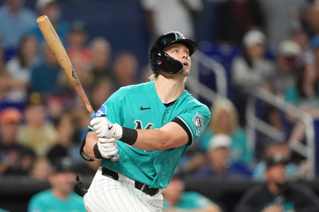 Miami Marlins' Kyle Stowers watches his ball after hitting a home run during the third inning of a baseball game against the San Diego Padres, Sunday, July 26, 2026, in Miami. (AP Photo/Rebecca Blackwell)