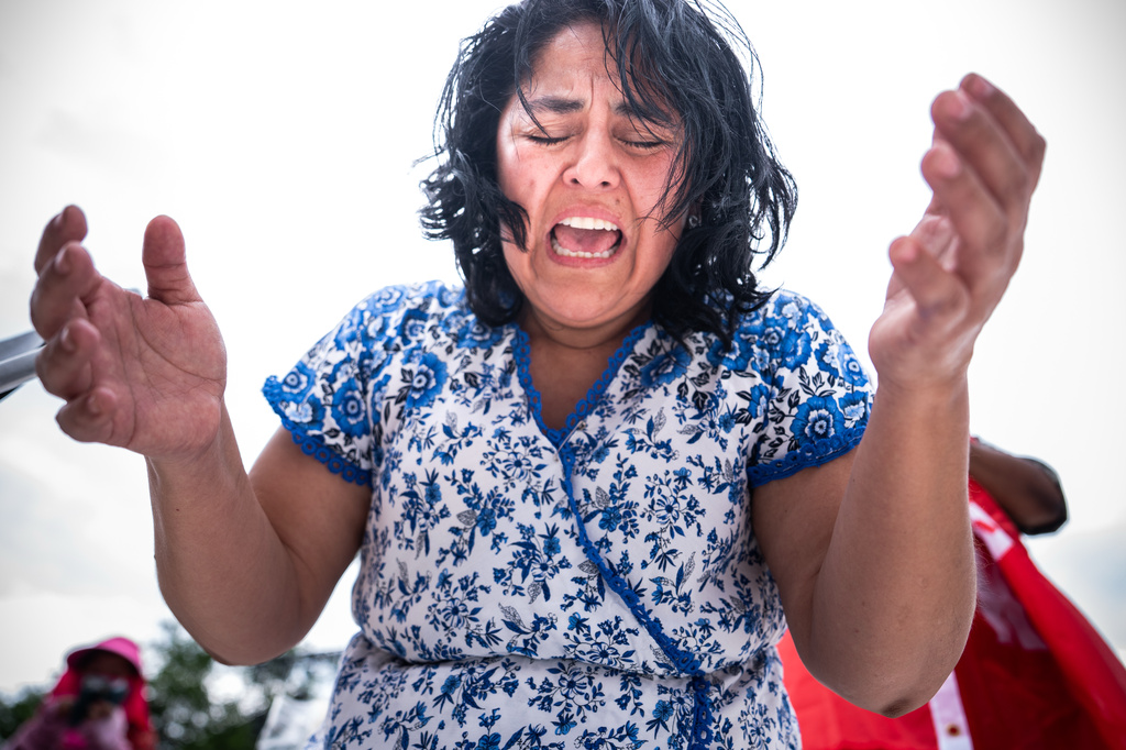 A person worships to Christian music at Rededicate 250, a mostly conservative Christian prayer gathering in honor of the United States' 250th anniversary, on the National Mall, Sunday, May 17, 2026, in Washington. (AP Photo/Julia Demaree Nikhinson)