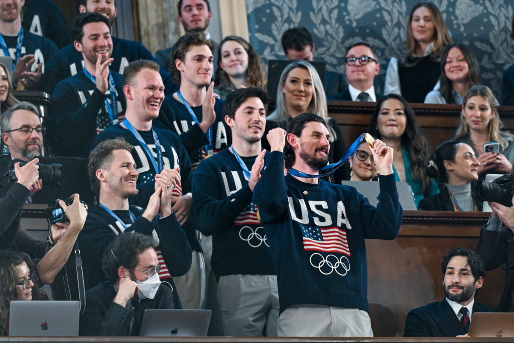 Members of the United States' Olympic hockey team, goalie Connor Hellebuyck in front, attend President Donald Trump's State of the Union address to a joint session of Congress in the House chamber at the U.S. Capitol in Washington, Tuesday, Feb. 24, 2026. (Kenny Holston/The New York Times via AP, Pool)