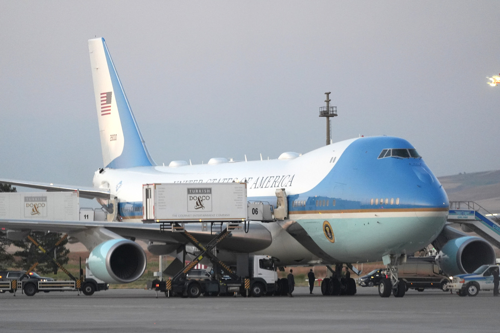 Catering trucks are parked at Air Force One on the tarmac as the motorcade carrying U.S. President Donald Trump arrives on the tarmac to depart following the NATO summit at Ankara International Airport in Ankara, Turkey, Wednesday, July 8, 2026. (AP Photo/Alex Brandon)