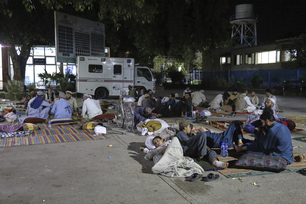 Afghans affected by a powerful earthquake that struck eastern Afghanistan on Sunday rest outside Nangarhar Regional Hospital in Jalalabad, Afghanistan, Wednesday, Sept. 3, 2025. (AP Photo/Siddiqullah Alizai)