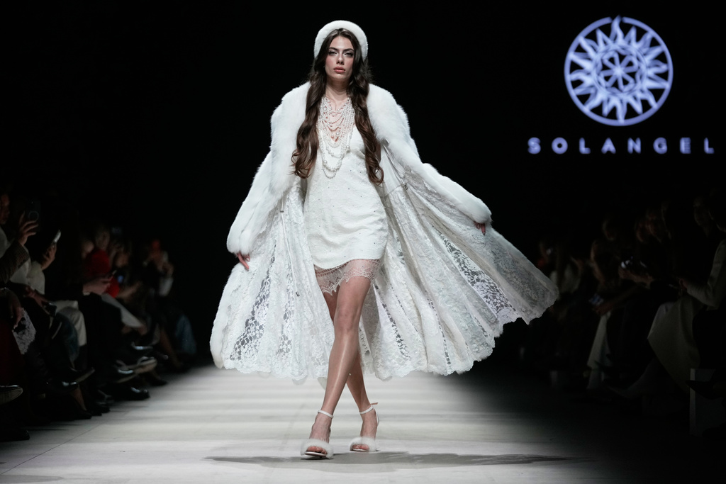 A model wears a creation by Russian brand Solangel on a runway at the Moscow Fashion Week in Moscow, Saturday, March 14, 2026. (AP Photo/Pavel Bednyakov)