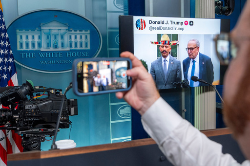 A video posted on Donald Trump's Truth Social account depicting Senate Minority Leader Chuck Schumer, of N.Y., and House Minority Leader Hakeem Jeffries, of N.Y., is shown in the James Brady Press Briefing Room at the White House, Wednesday, Oct. 1, 2025, in Washington. The sombrero and mustache were superimposed on Jeffries. (AP Photo/Alex Brandon) A video posted on Donald Trump's Truth Social account depicting Senate Minority Leader Chuck Schumer, of N.Y., and House Minority Leader Hakeem Jeffries, of N.Y., is shown in the James Brady Press Briefing Room at the White House, Wednesday, Oct. 1, 2025, in Washington. The sombrero and mustache were superimposed on Jeffries. (AP Photo/Alex Brandon)