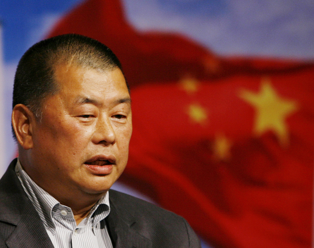 FILE - Hong Kong media tycoon Jimmy Lai, then owner of the Hong Kong and Taiwan newspaper Apple Daily, attends the Seminar on Tenth Anniversary of Hong Kong's Handover organized by Democratic Party in Hong Kong, June 9, 2007. (AP Photo/Kin Cheung, File)